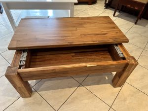 Coffee table in solid wood paneling with unique sliding top. Woodesignz.nz