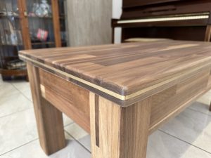 Coffee table in solid wood paneling with unique sliding top. Woodesignz.nz