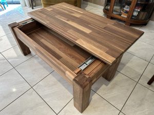 Coffee table in solid wood paneling with unique sliding top. Woodesignz.nz