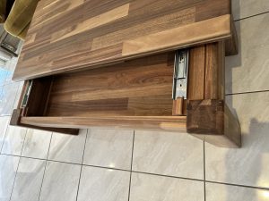 Coffee table in solid wood paneling with unique sliding top. Woodesignz.nz